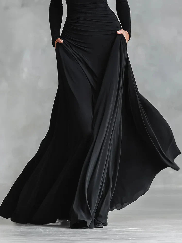 Modern long black crepe dress with pleated boat neckline