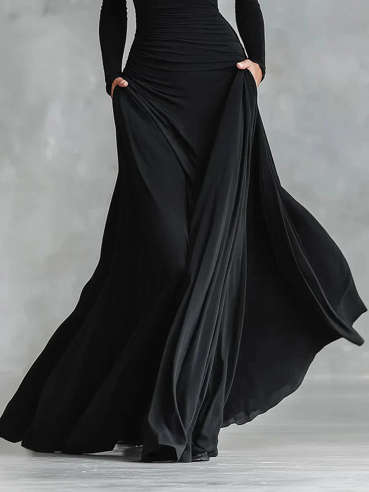 Modern long black crepe dress with pleated boat neckline